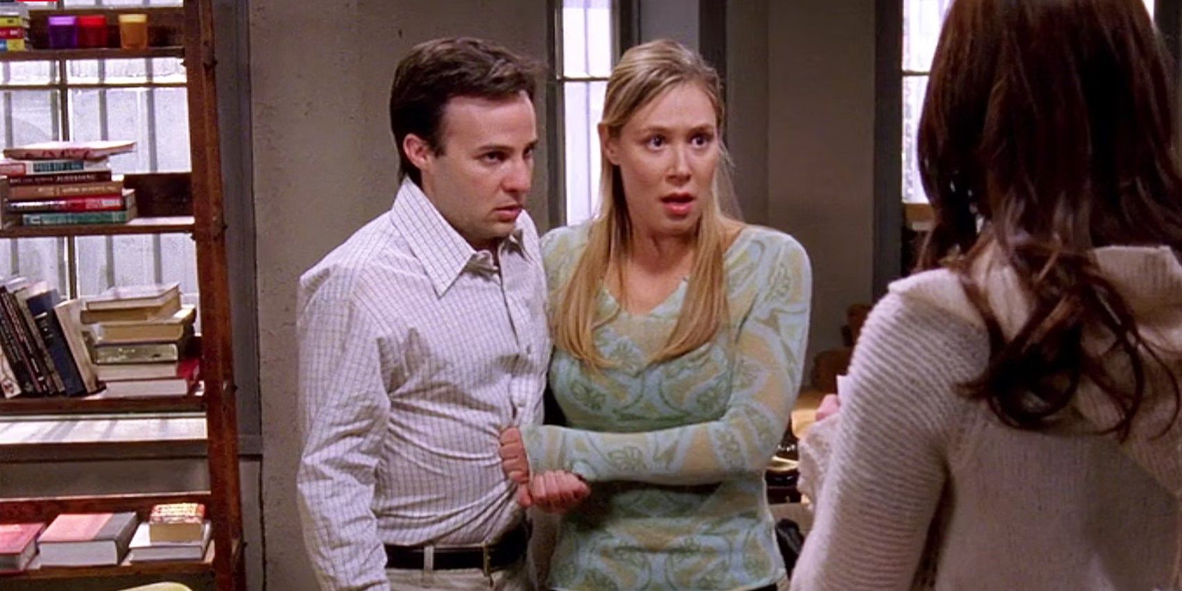 Paris (Liza Weil) and Doyle (Danny Strong) stand together and look shocked in Gilmore Girls.