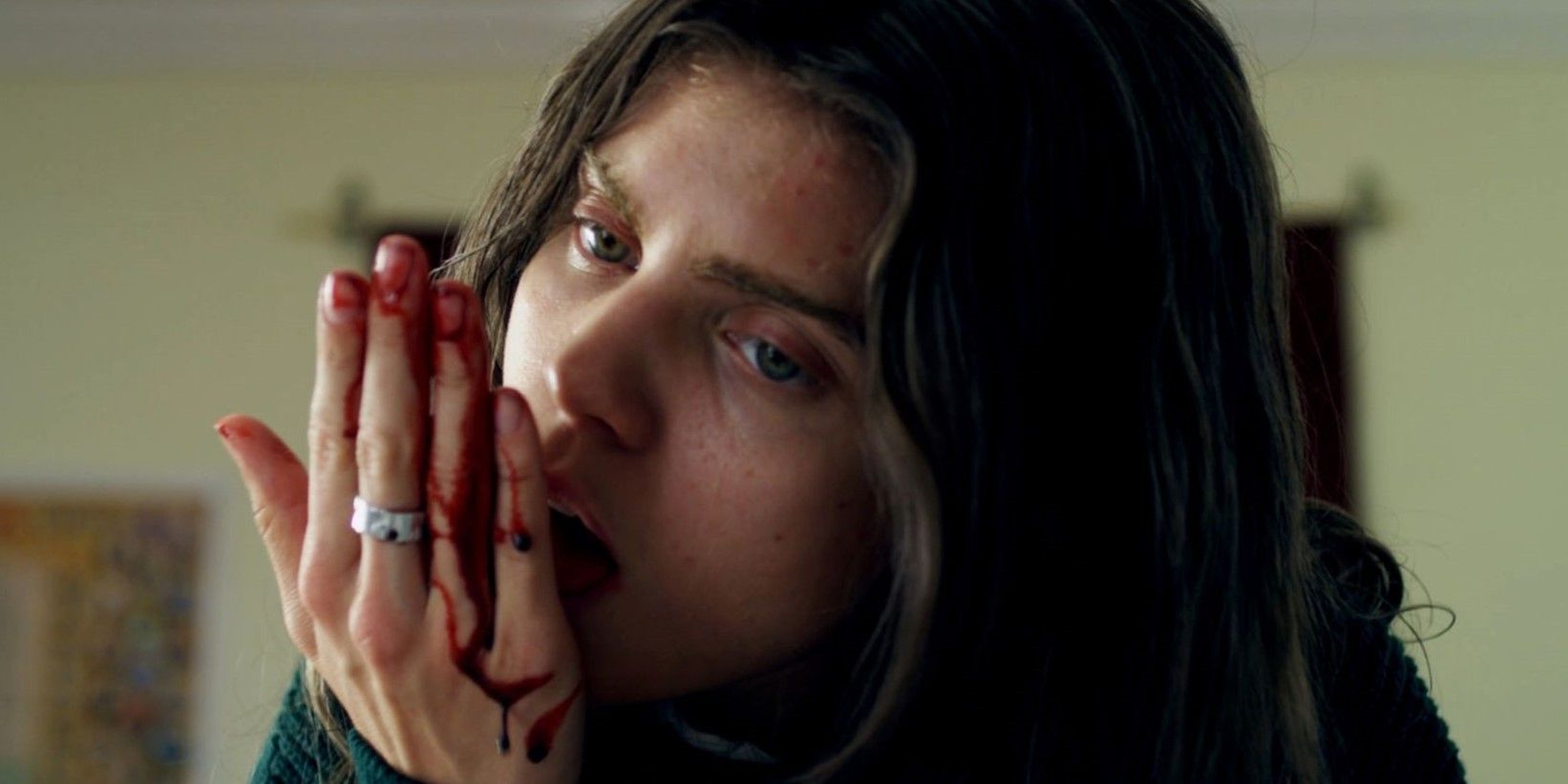 Still from 'Excision': Pauline (AnnaLynne McCord) licks blood from her hand.