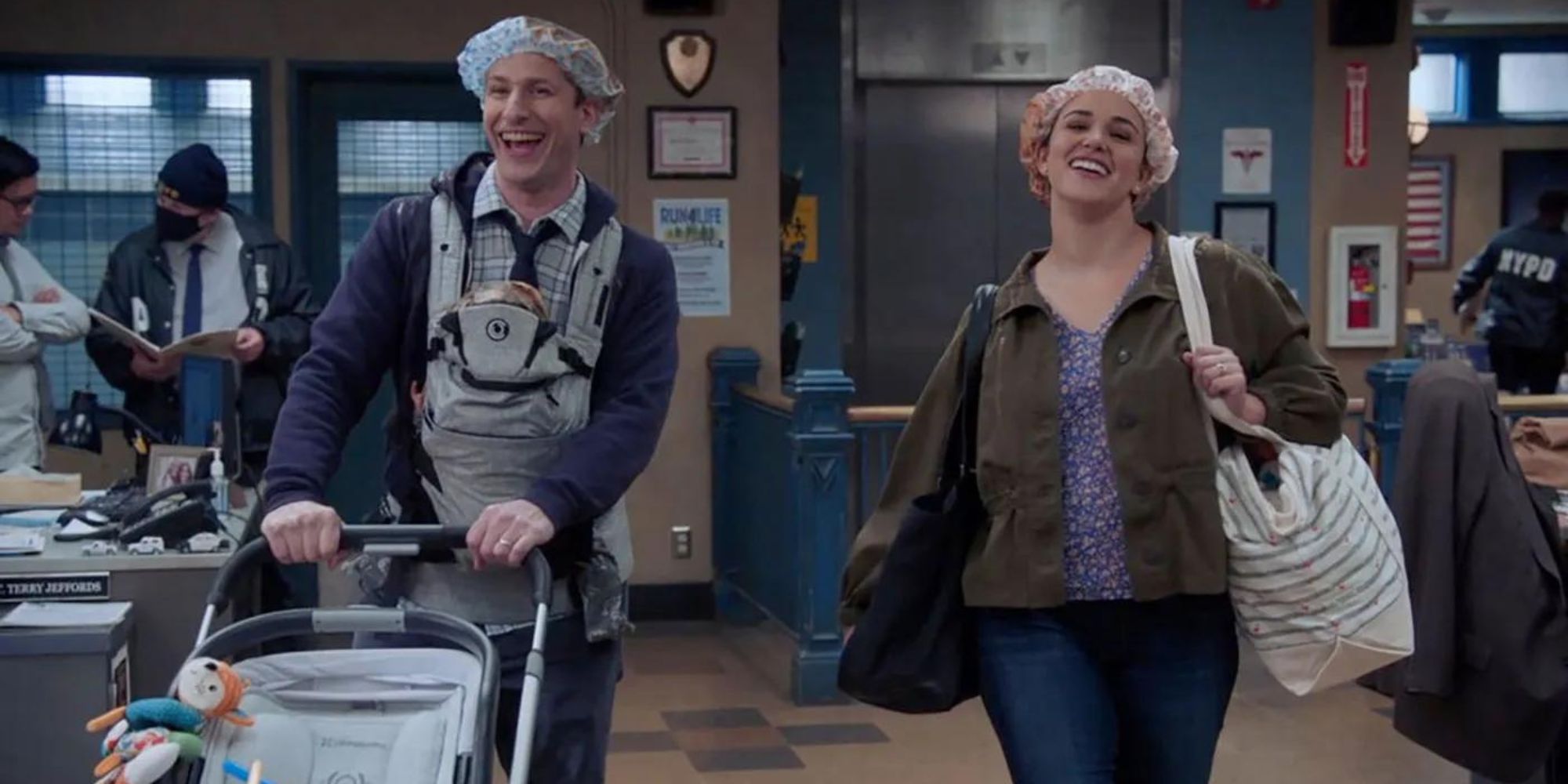 Jake and Amy from Brooklyn Nine-Nine carrying Mac to the precinct