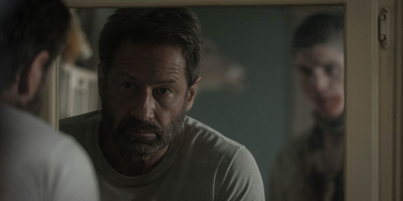 David Duchovny as Bill looking at an undead Timmy (Jack Mulhern) in the mirror in Pet Sematary: Bloodlines