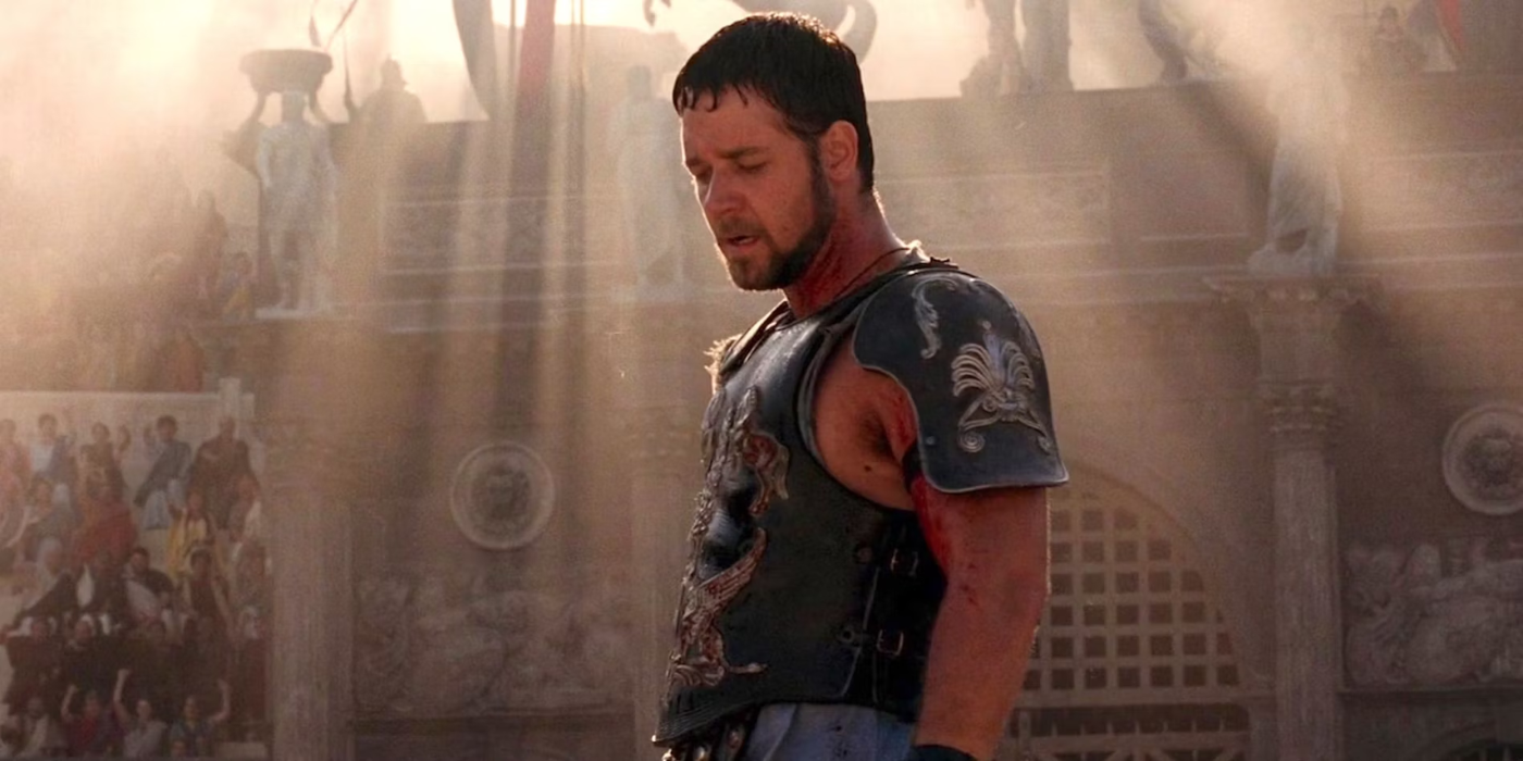 Maximus standing in the arena with the sunlight above him in Gladiator.