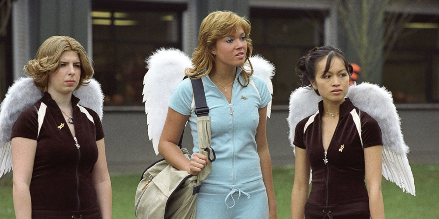 Heather Matarazzo, Mandy Moore, and Elizabeth Thai wearing angel wings in 'Saved!'