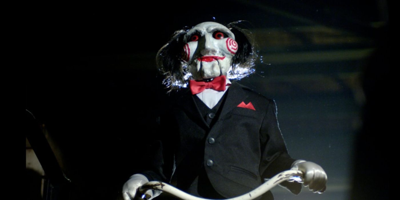 Jigsaw puppet on his tricycle in Saw X (1)