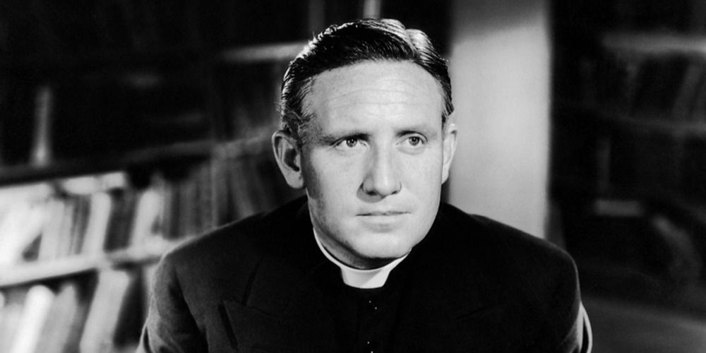 Spencer Tracy in 'Boys Town', wearing a priest's clothes