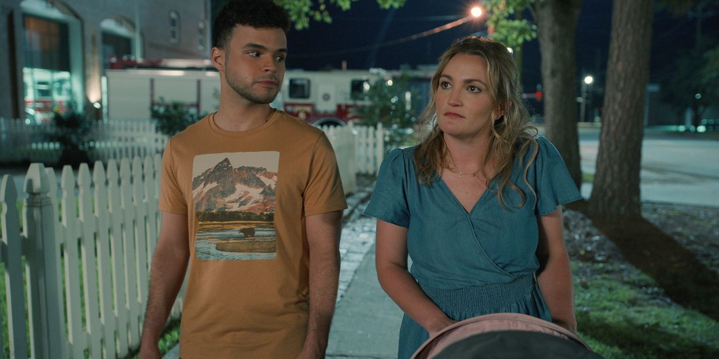 Chris Medlin as Isaac Downey and Jamie Lynn Spears as Noreen Fitzgibbons walking outside with a stroller in Sweet Magnolias Season 3