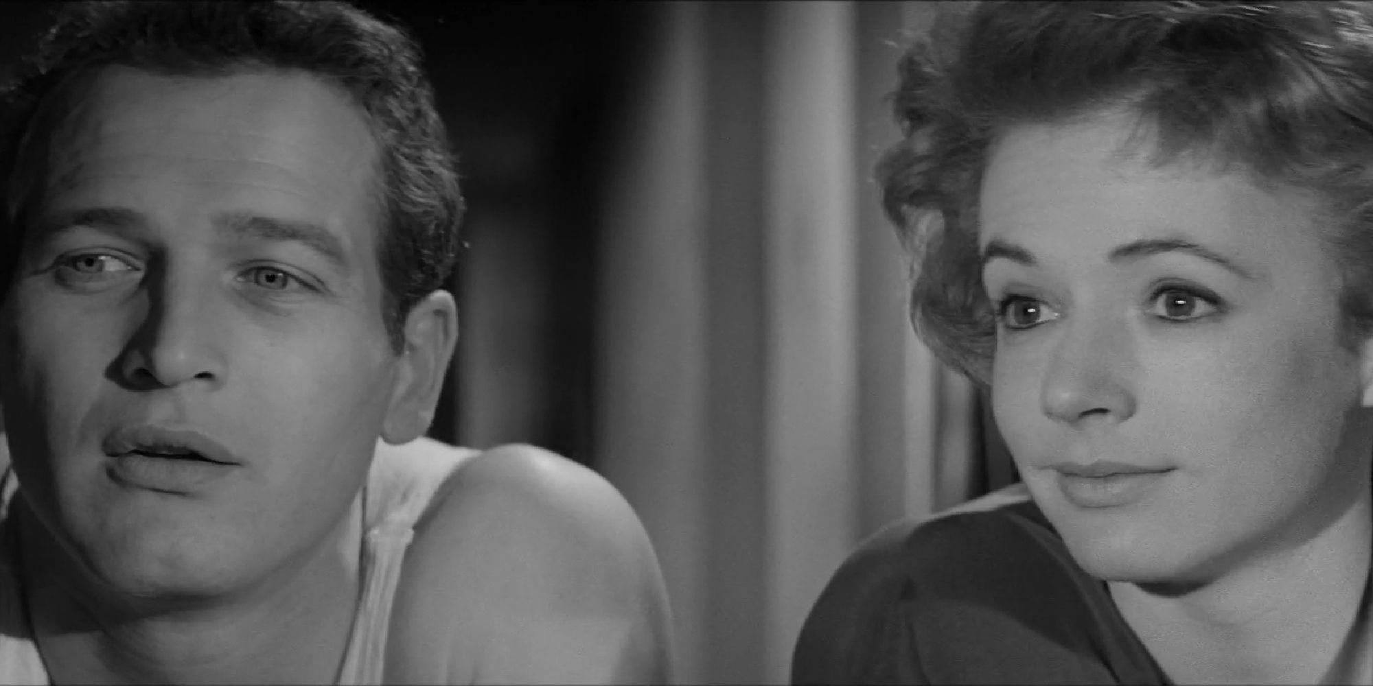 Paul Newman and Piper Laurie as Eddie and Sarah nect to each other looking ahead in the film The Hustler.