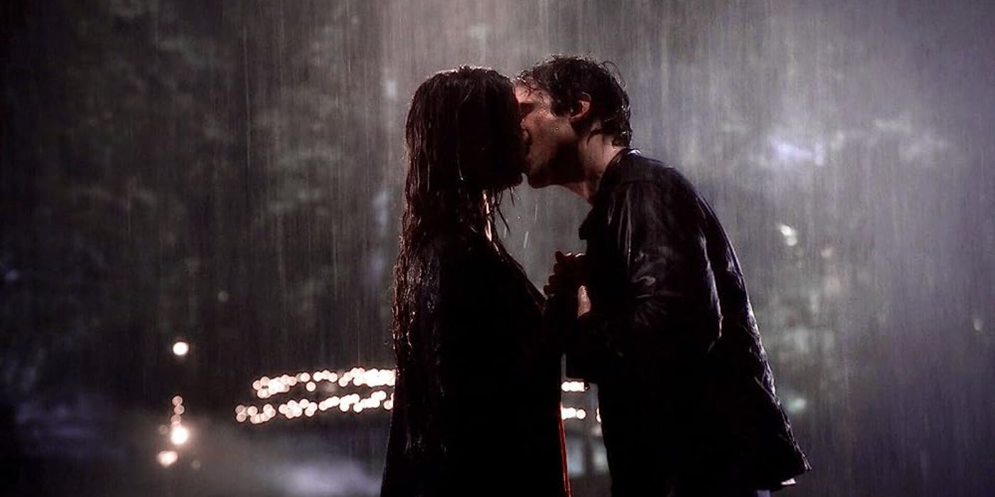 Elena, played by Nina Dobrev, kissing Damon, played by Ian Somerhalder, in the rain in 'The Vampire Diaries' Season 6 Episode 7.