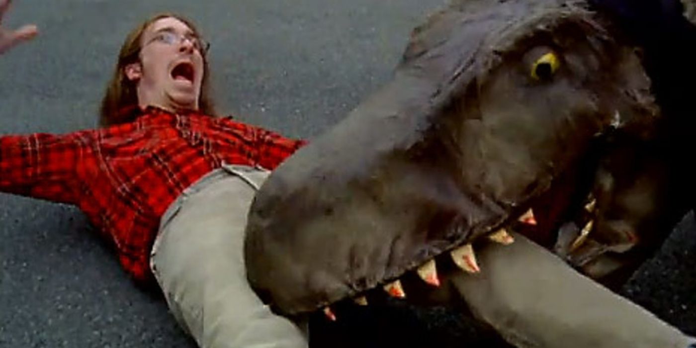 A man being bitten in the leg by a dinosaur in 'The VelociPastor.' 