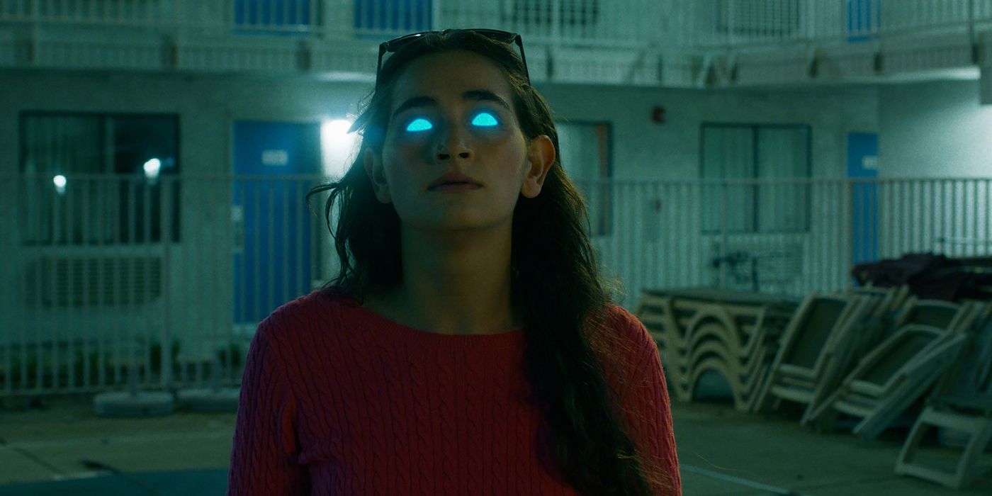 A still from the movie The Becomers featuring Isabel Alamin with blue glowing eyes.