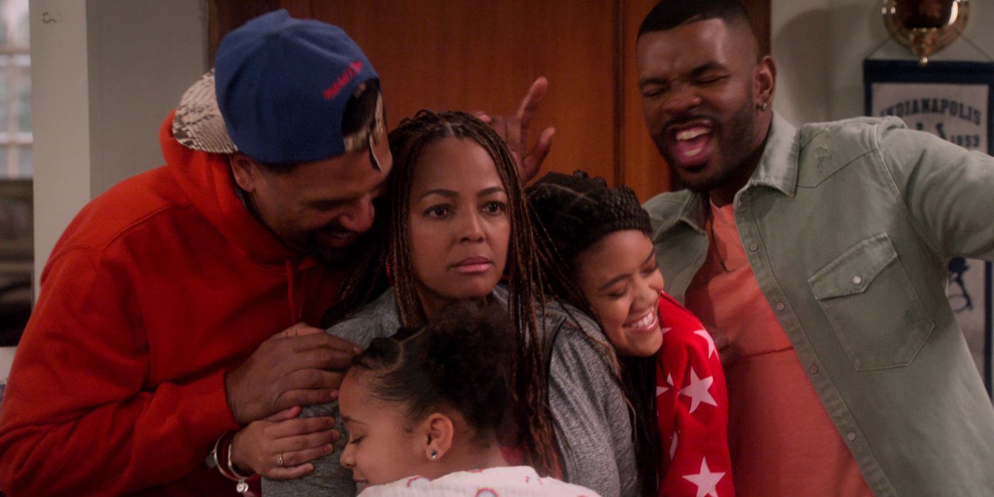 Kim Fields as Regina in the middle of a group hug in The Upshaws Part 3