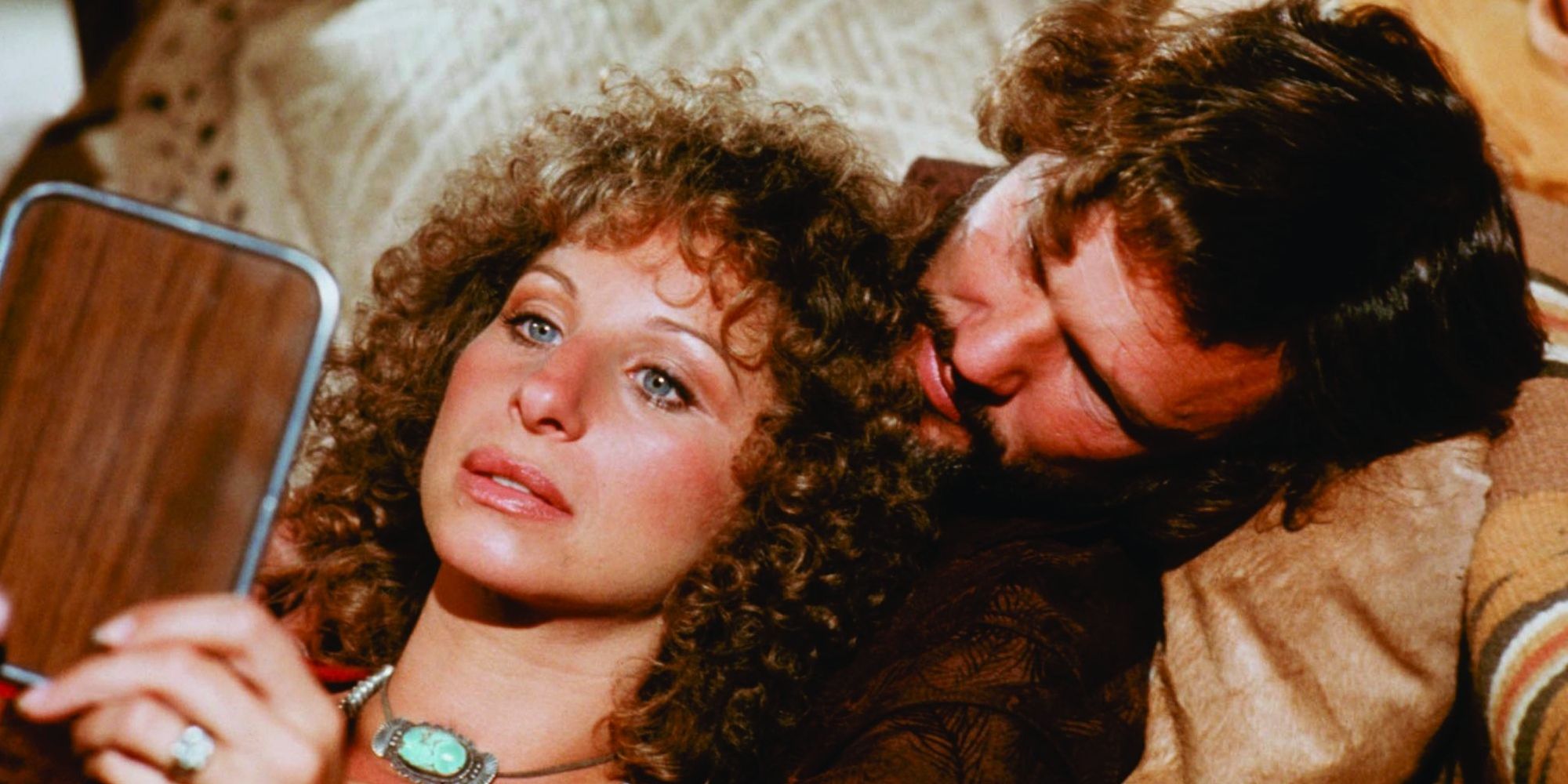 Barbra Streisand as Esther Hoffman leaning on Kris Kristofferson as John Norman in A Star is Born (1976)