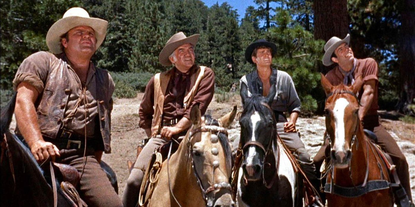 Lorne Greene, Pernell Roberts, Dan Blocker and Michael Landon as Ben, Adam, Hoss, and Joe Cartwright, riding horses and looking at the sky in Bonanza