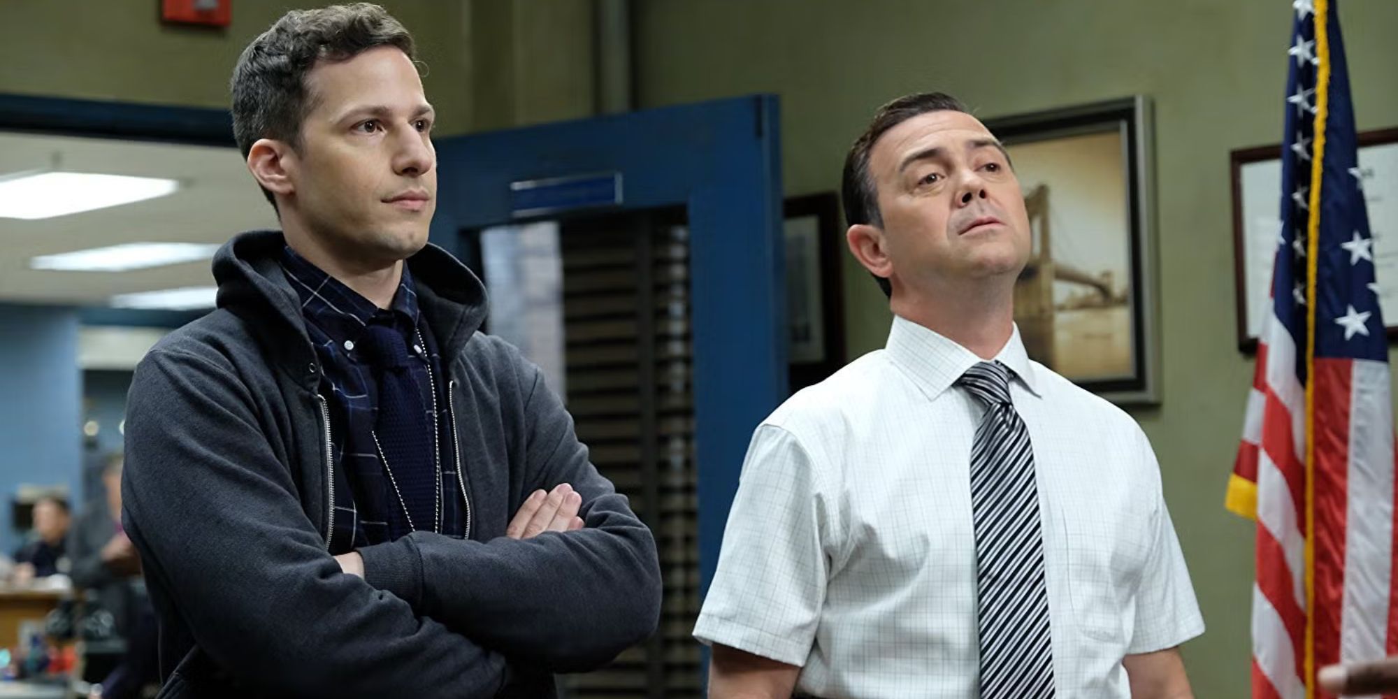 Jake and Charles from Brooklyn 99 standing together