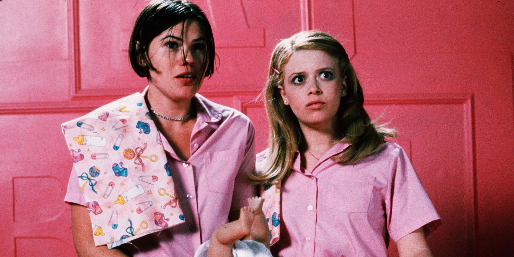 Natasha Lyonne as Megan and Clea DuVall as Graham in But I’m a Cheerleader looking at someone off-camera.