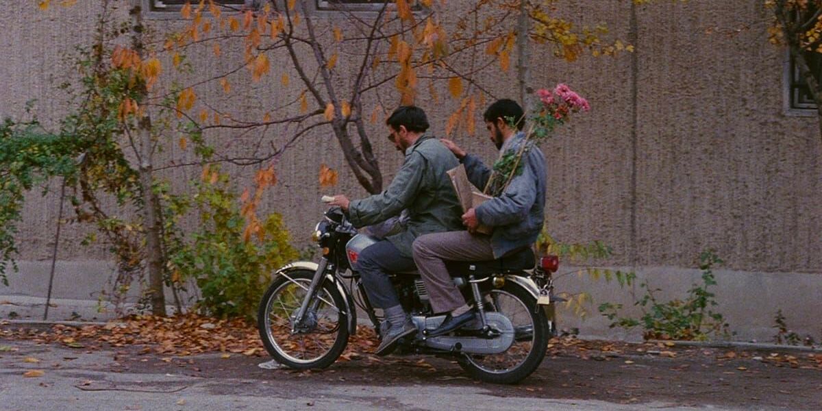 Two men ride a motorbike in 'Close-Up' (1990)