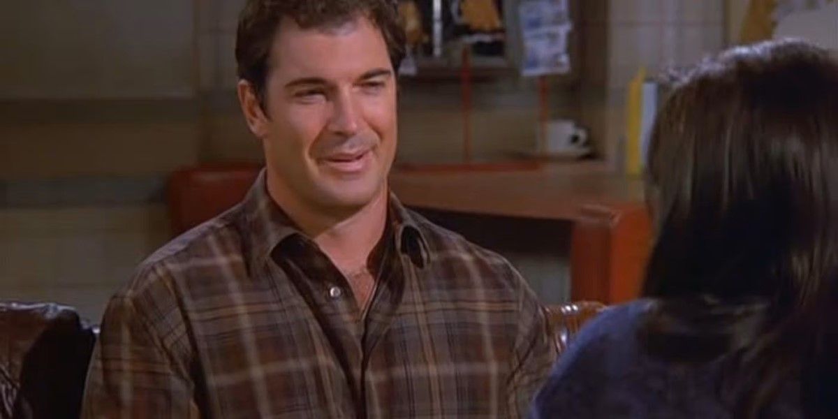 David Puddy sits in the diner with Elaine on 'Seinfeld'