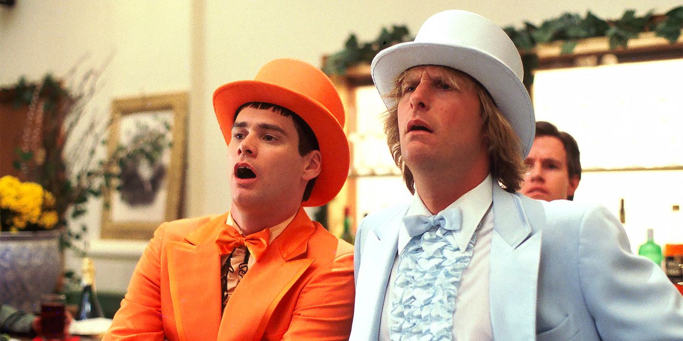 Lloyd Christmas (Jim Carrey) and Harry Dunne (Jeff Daniels) wearing suits in 'Dumb and Dumber'