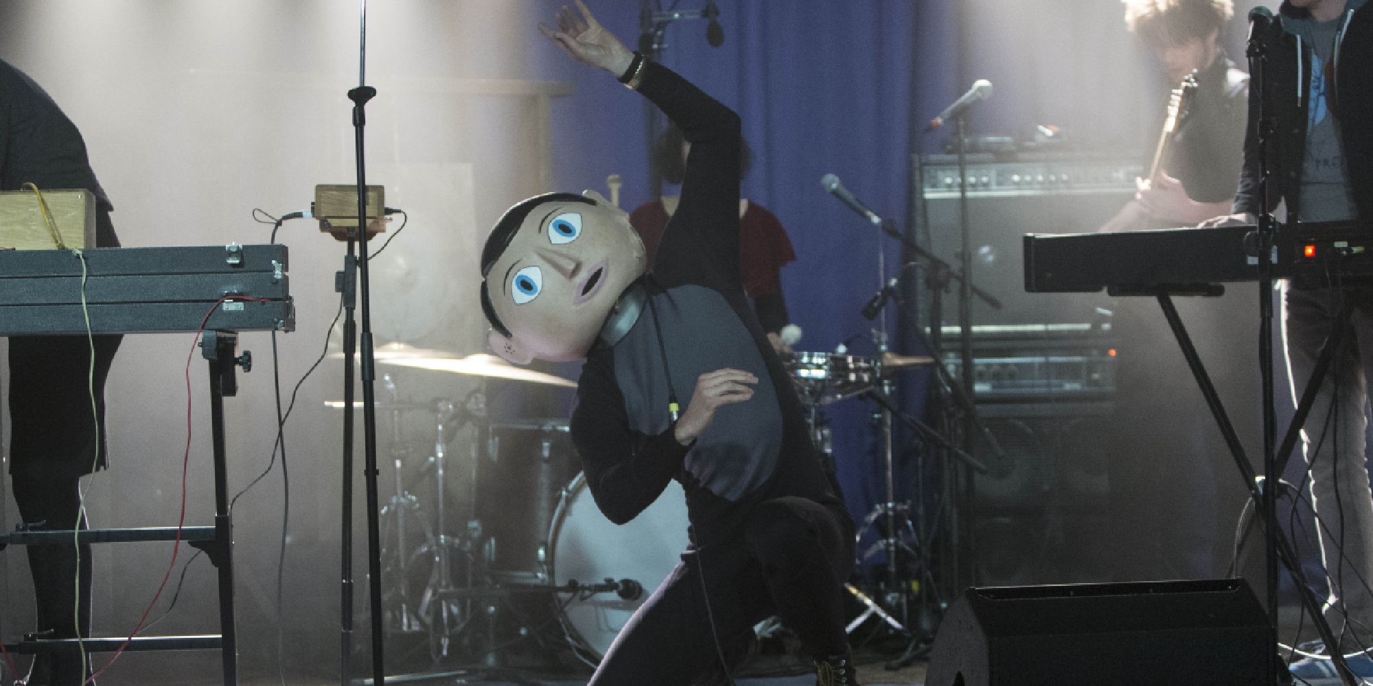 Frank on stage performing with his band in the film Frank