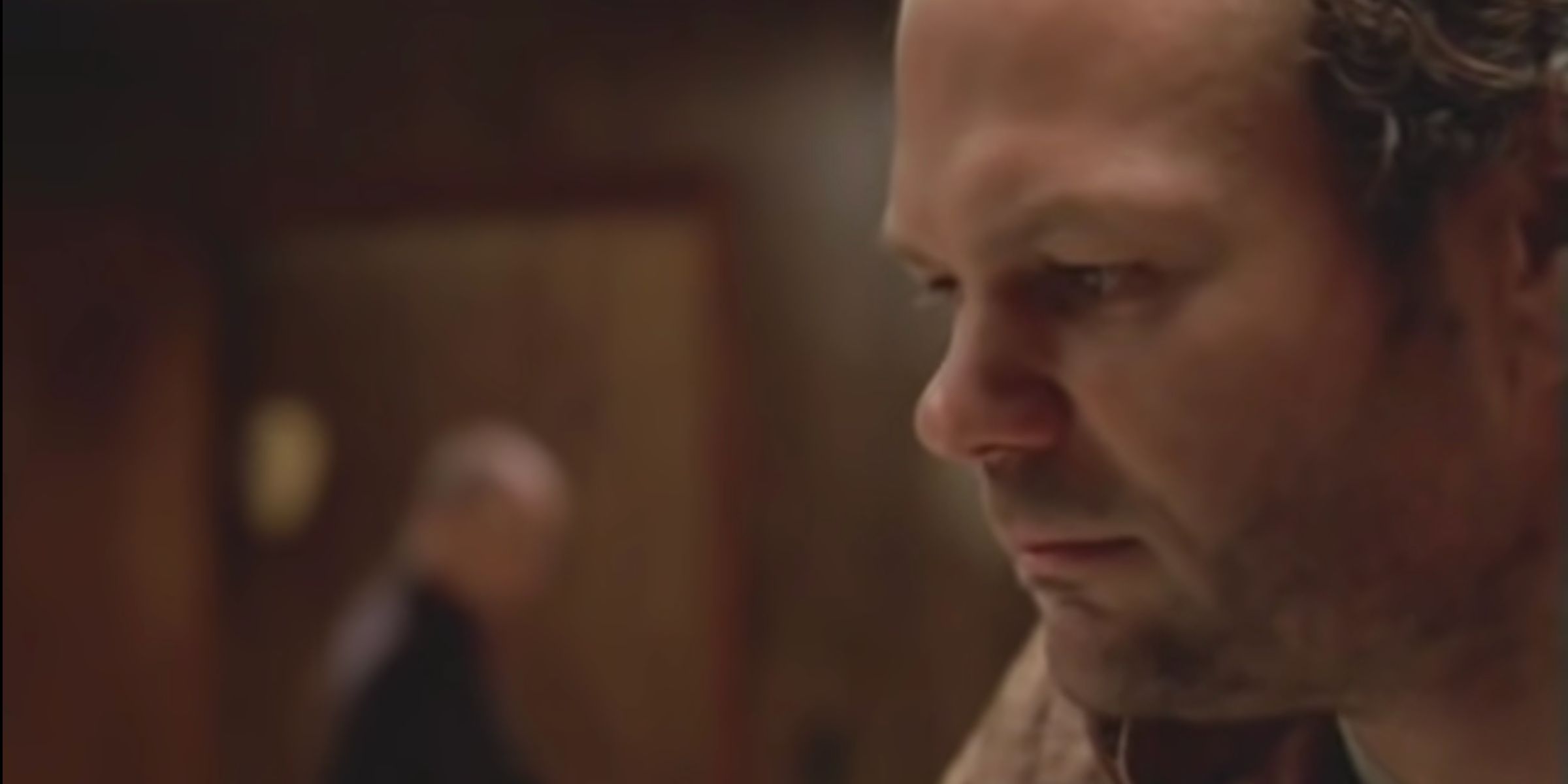 Frank Sobotka (Chris Bauer) sits in his office talking to a lawyer.