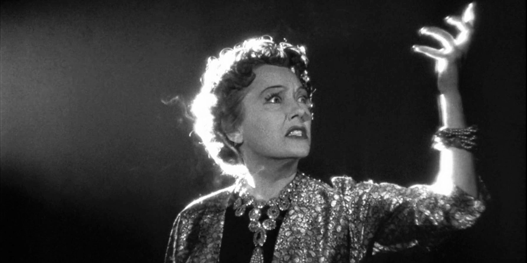 Norma Desmond gesturing dramatically in Sunset Boulevard