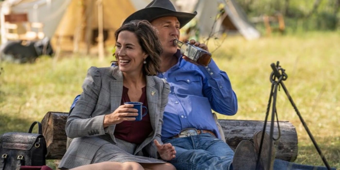 Gov. Lynelle Perry and John Dutton sit close and share a drink in Yellowstone. 