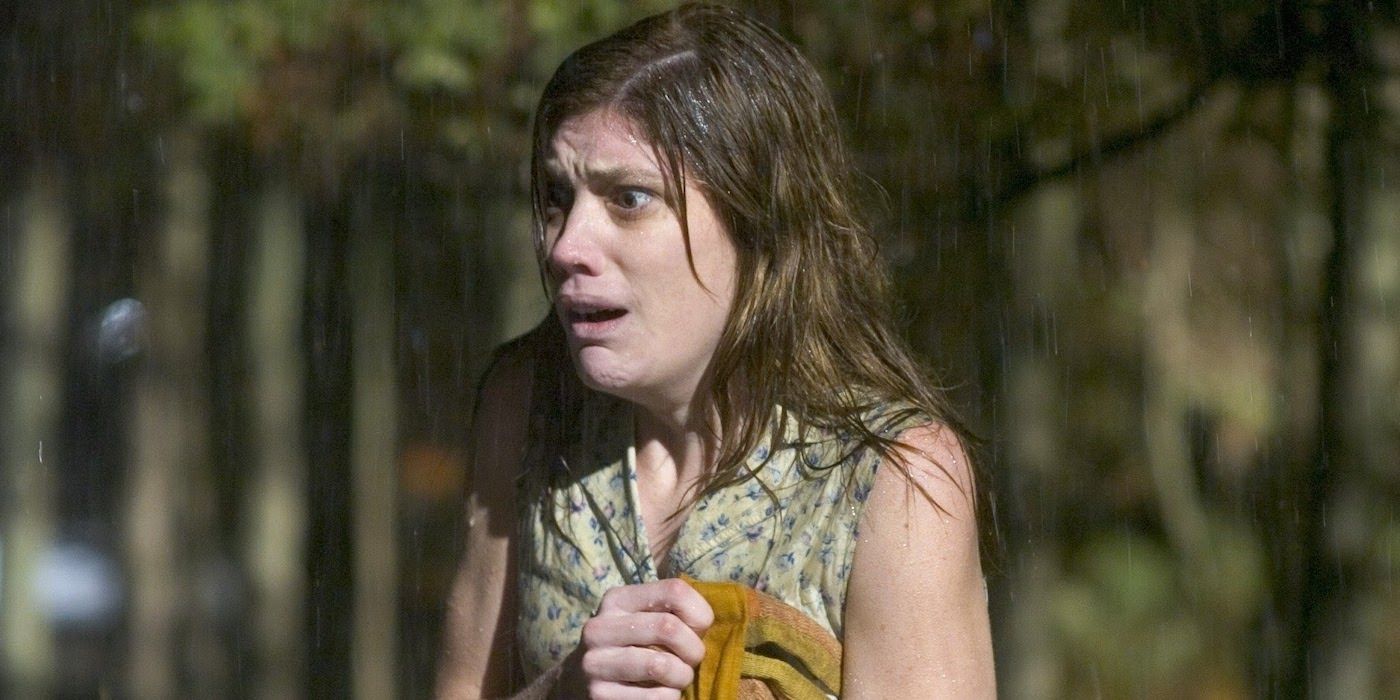 Jennifer Carpenter as Emily Rose, standing in the rain looking horrified in The Exorcism of Emily Rose