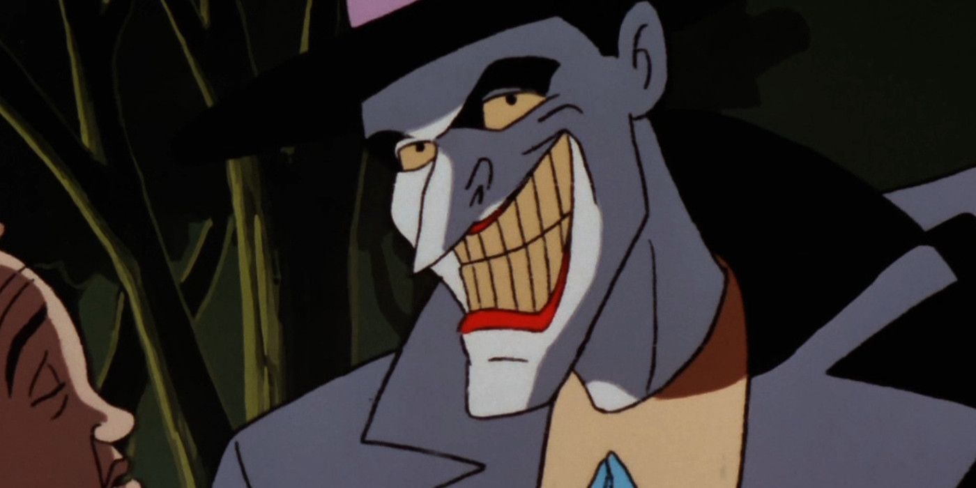 The animated Joker donning his signature smile in Batman: The Animated Series.