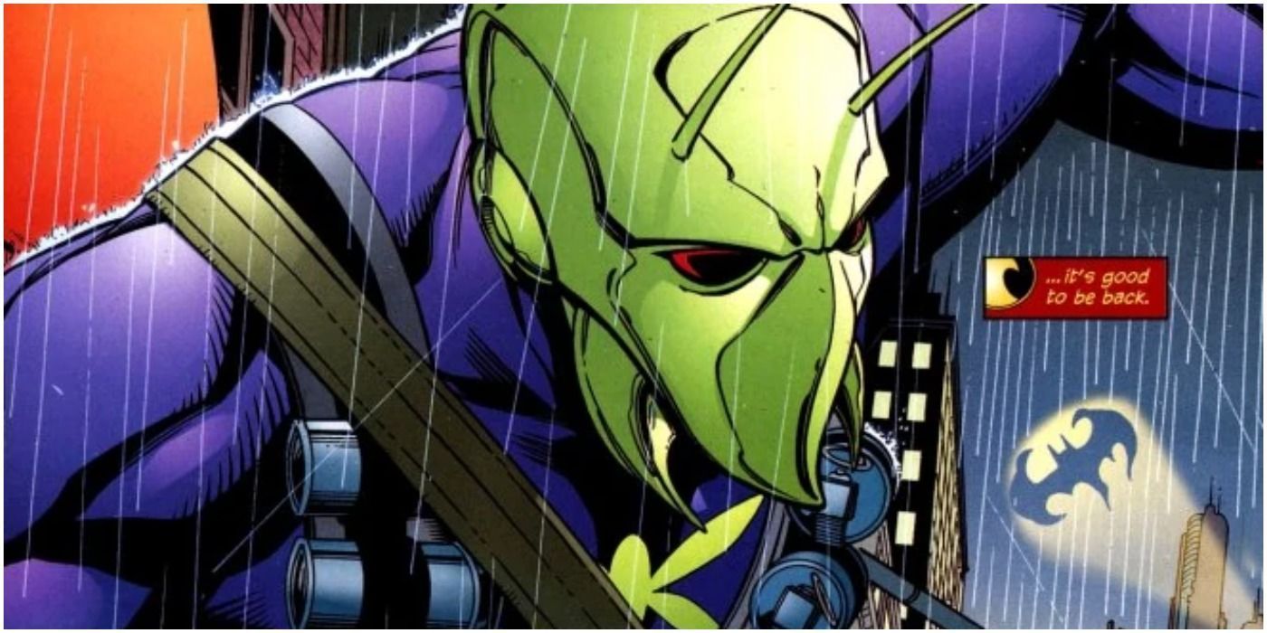 Killer Moth, dressed in a purple and green moth-themed costume adorned with weaponry, stands in the rain as the Bat-signal flashes in the background. In a small red-and-yellow text box next to the villain is the sentence, &ldquo;&hellip;it&rsquo;s good to be back.&quot;