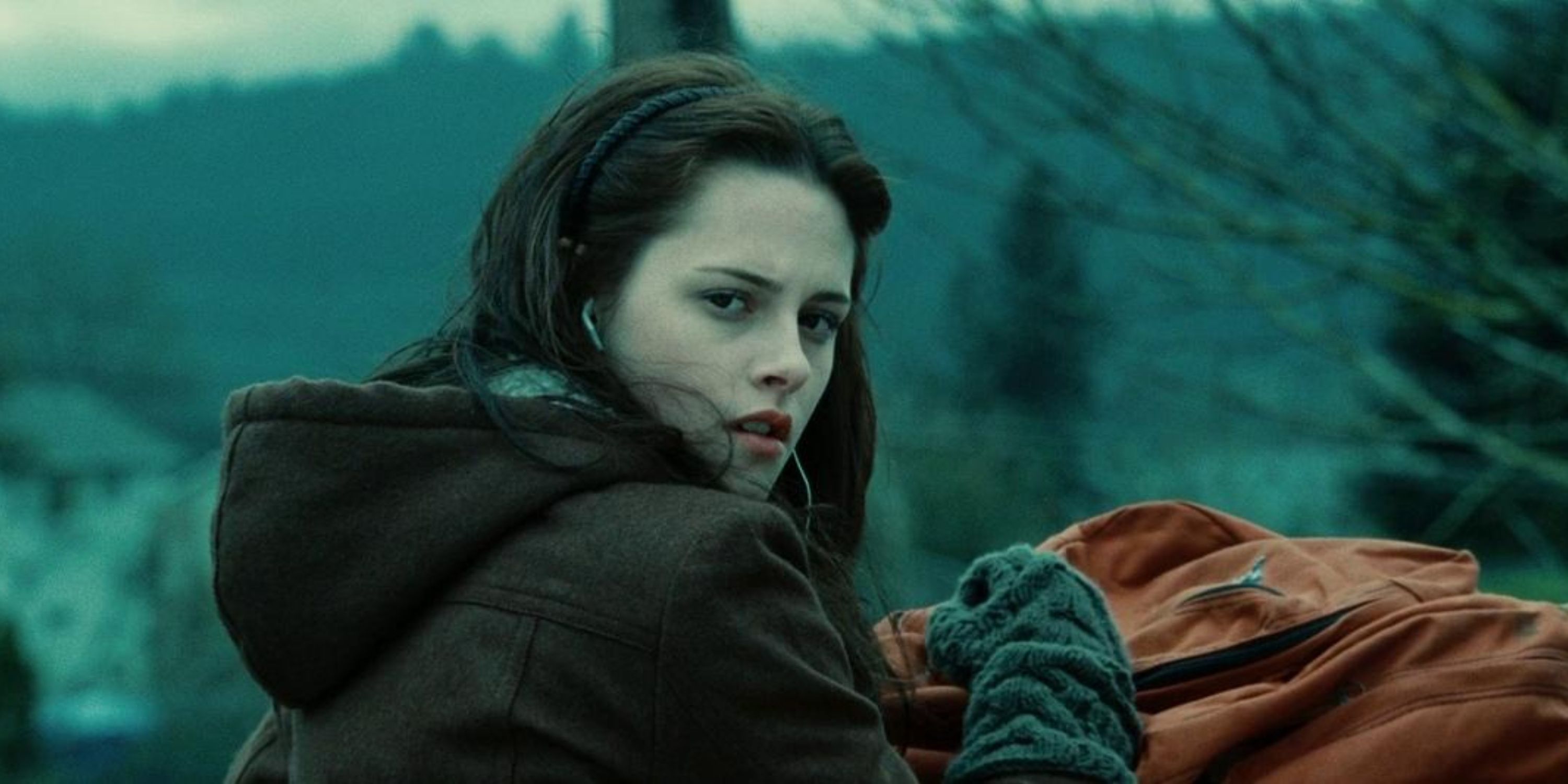 Bella Swan in 'Twilight', she is a white teenage girl looking back thoughtfully.