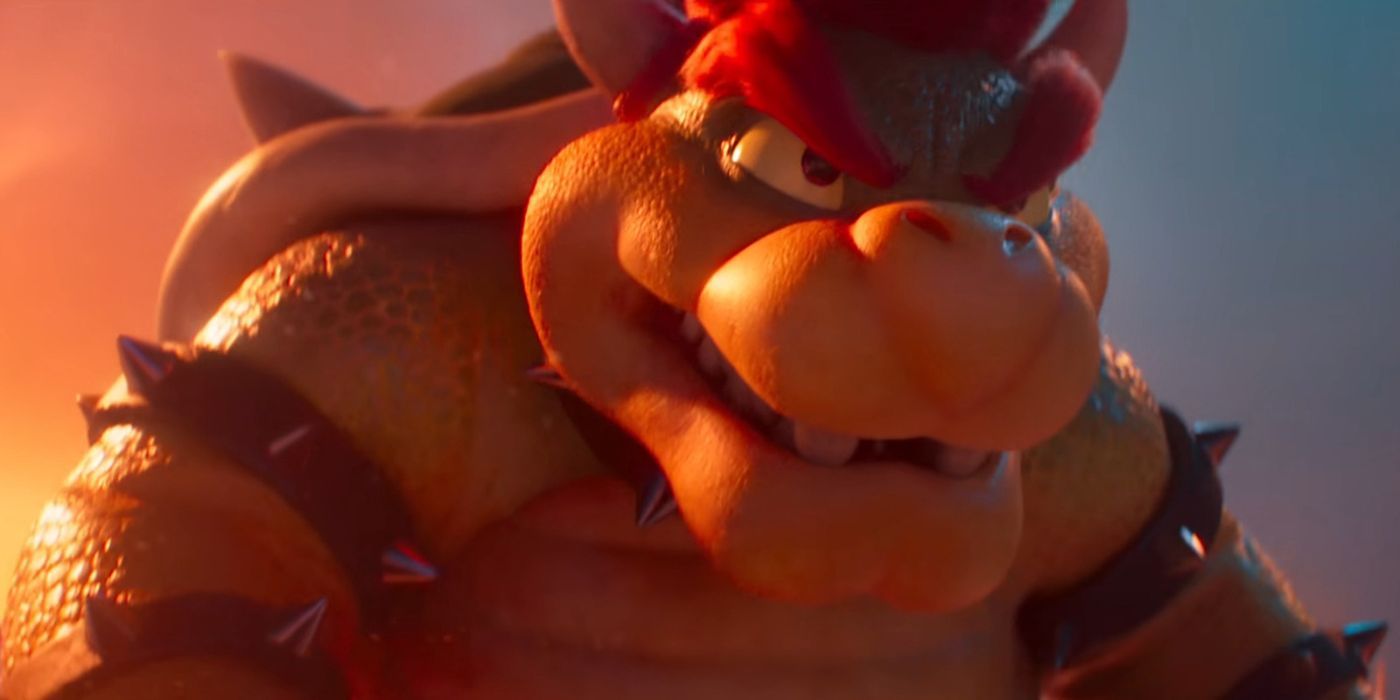 Bowser lit by fire looking intently in The Super Mario Bros. Movie