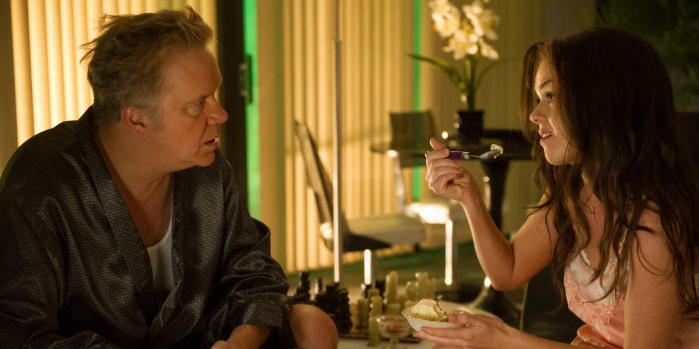 Isla Fisher and Tim Robbins as Frank and Melanie talking while eating in Life of Crime.