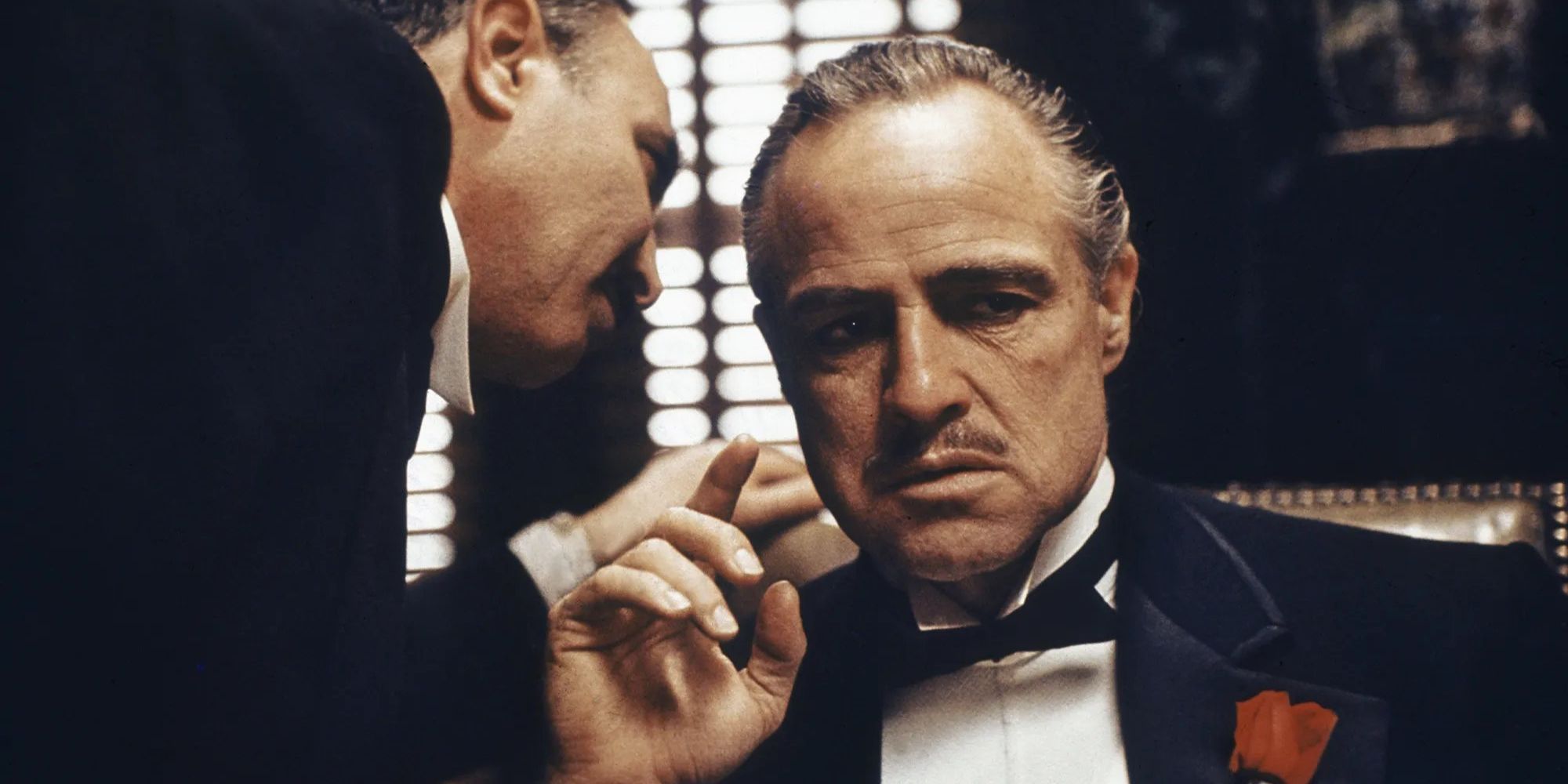 Marlon Brando as Vito Corleone hearing important news in The Godfather