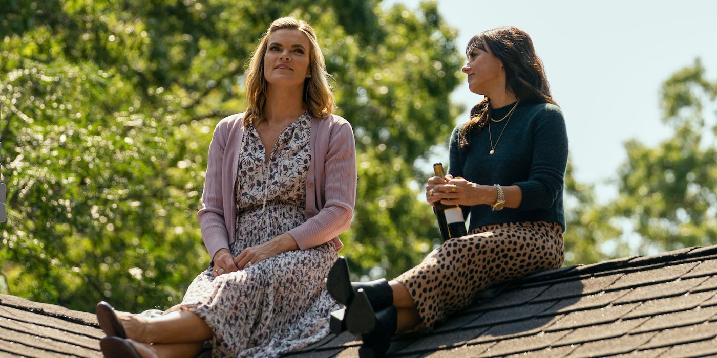 Missi Pyle as Hannah and Constance Zimmer as Shira sitting on roof in Harlan Coben's Shelter.