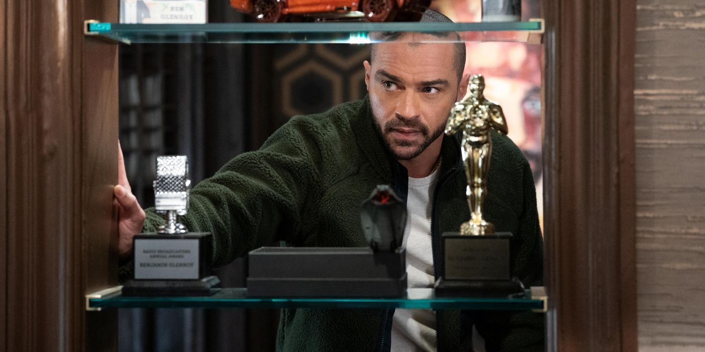 Tobert (Jesse Williams) looking at a shelf with trophies on it on Only Murders in the Building Season 3