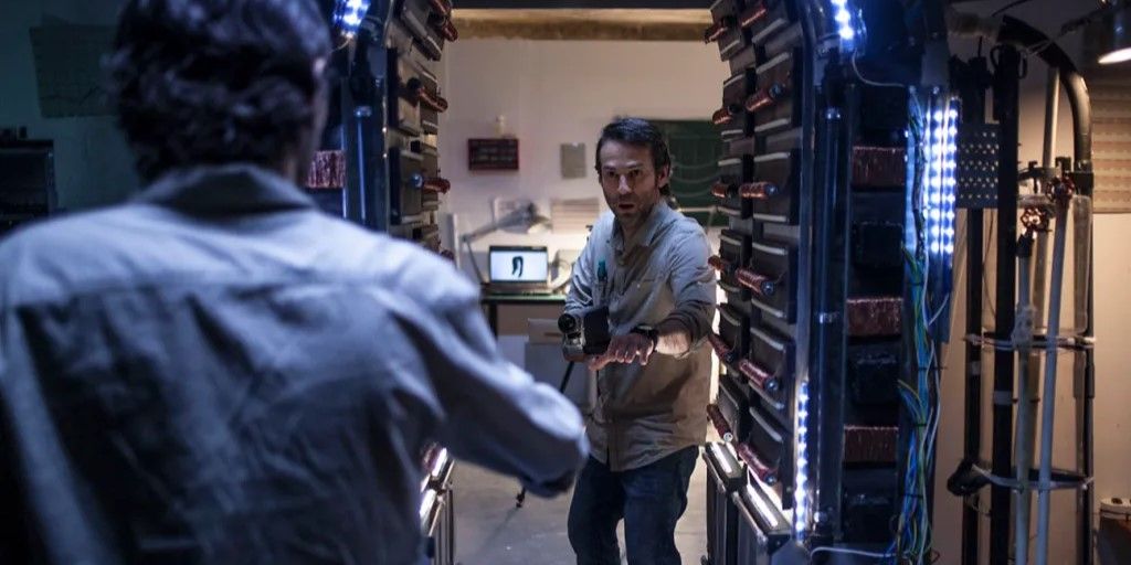 Identical men walk through a doorway towards each other.