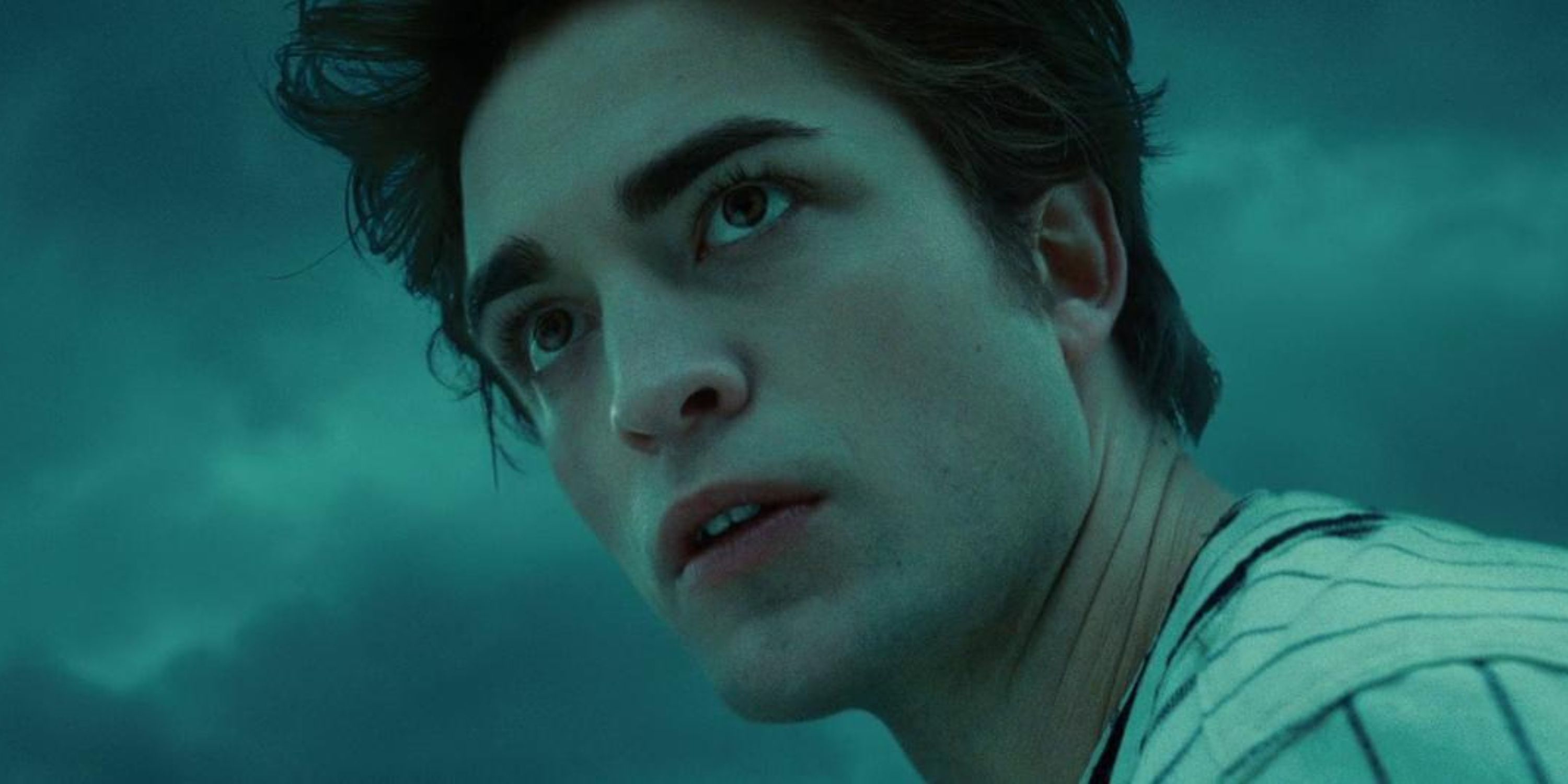 Robert Pattinson as Edward Cullen in 'Twilight', he is a white man with a baseball uniform in a cloudy field.