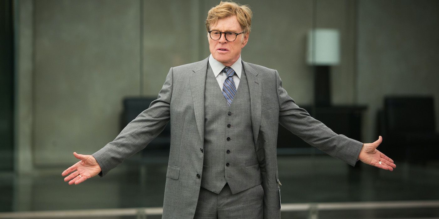 Robert Redford as Alexander Pierce standing with his arms outstretched in Captain America: The Winter Soldier