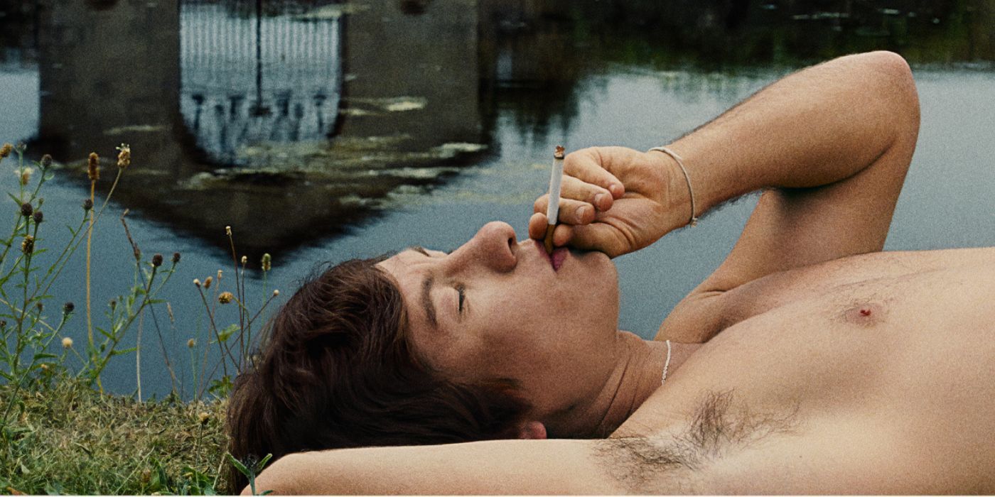 Barry Keoghan, shirtless, smoking a cigarette, on a poster for Saltburn
