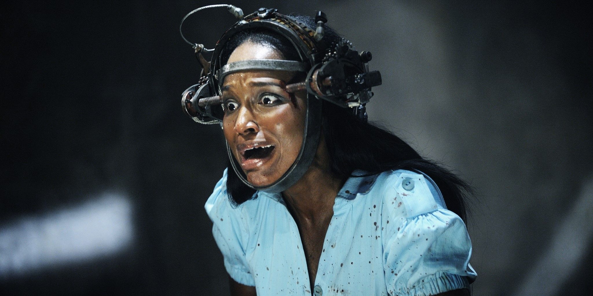 Tanedra Howard as Simone wearing a metal head contraption and screaming in Saw VI
