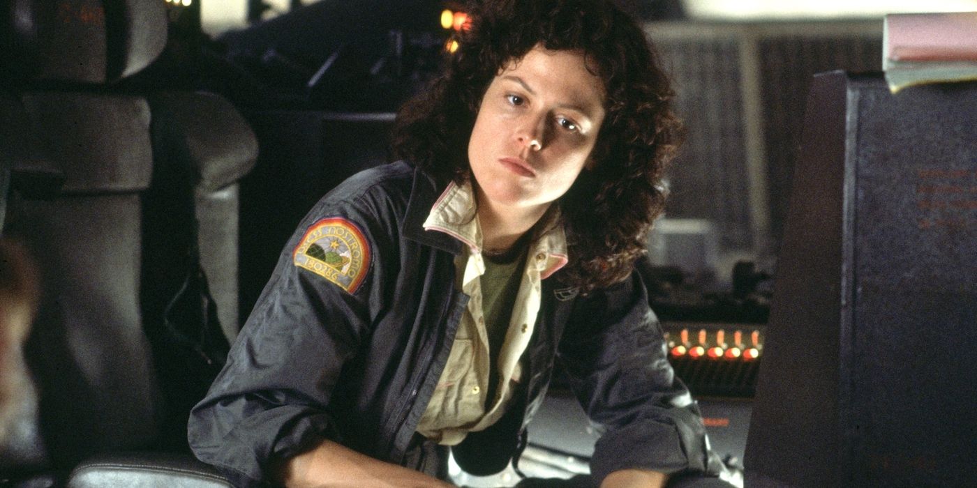 Ellen Ripley sitting down and looking at the camera in Alien