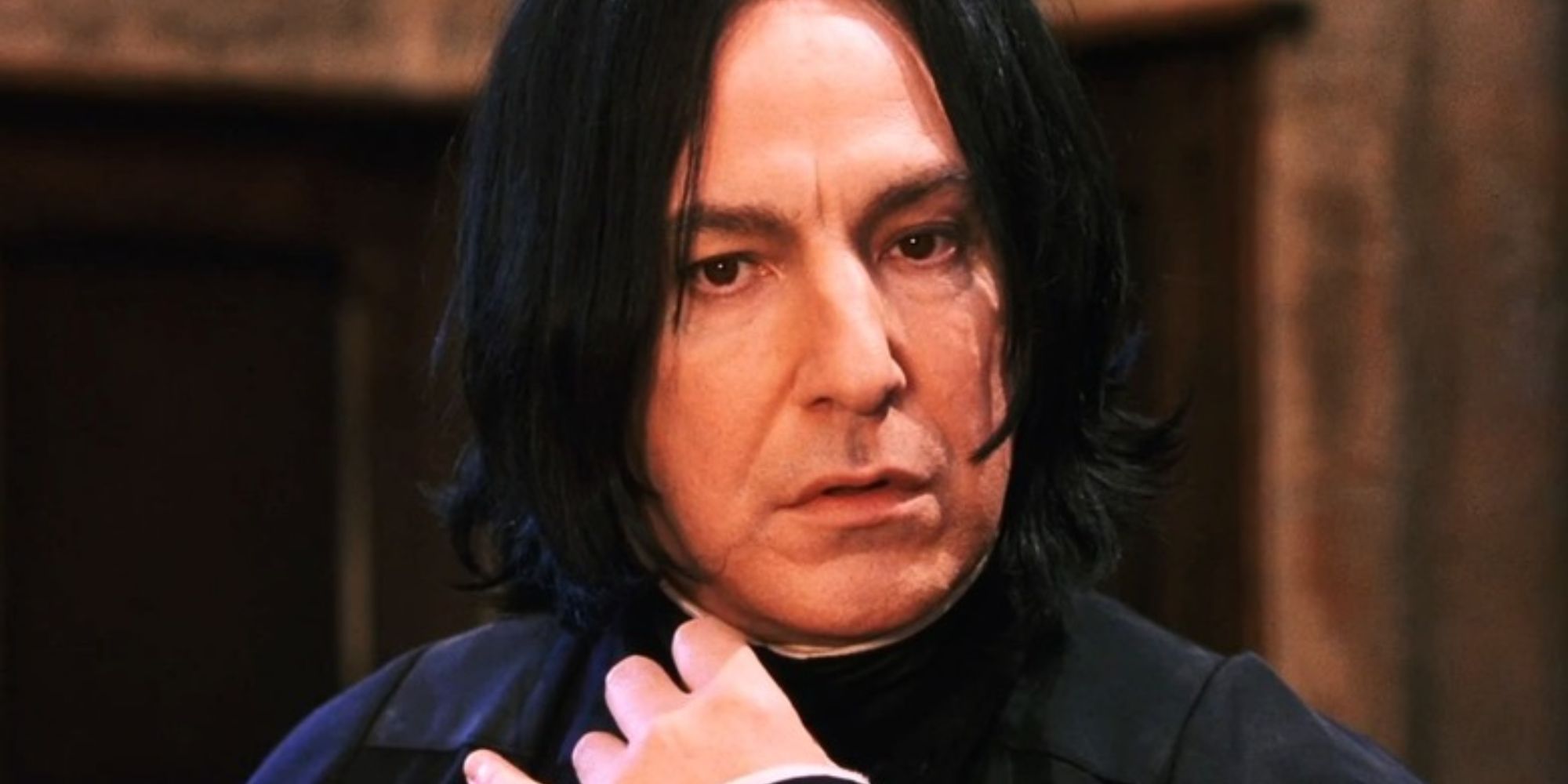 Snape (Alan Rickman) looks inquisitive in Harry Potter and the Sorcerer's Stone