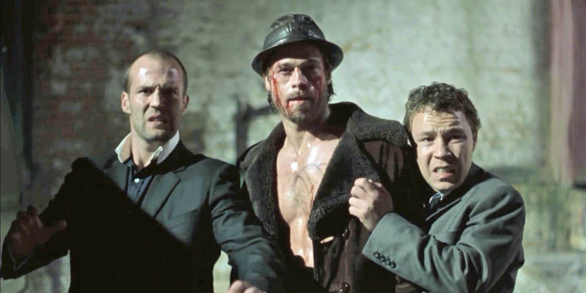 Jason Statham as Turkish, Brad Pitt as Mickey, and Stephen Graham as Tommy looking scared in Snatch