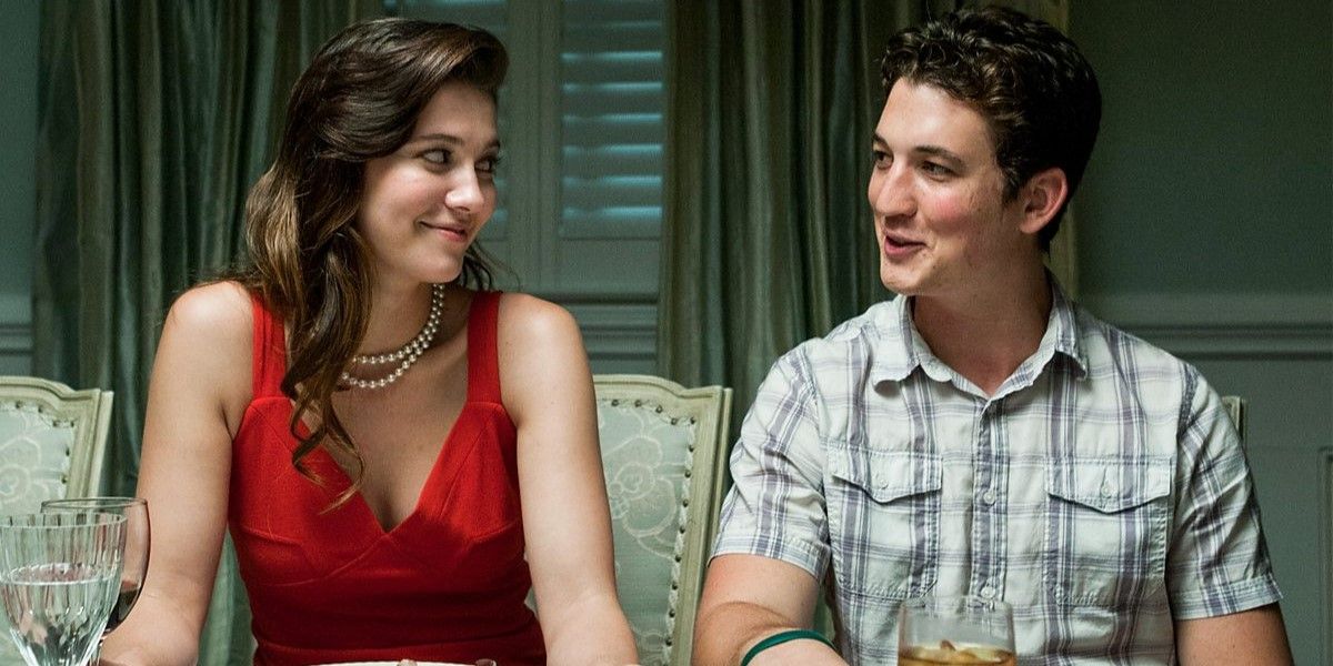 Mary Elizabeth Winstead and Miles Teller as Holly and Sutter Keely smiling and sitting at a table in 'The Spectacular Now'.