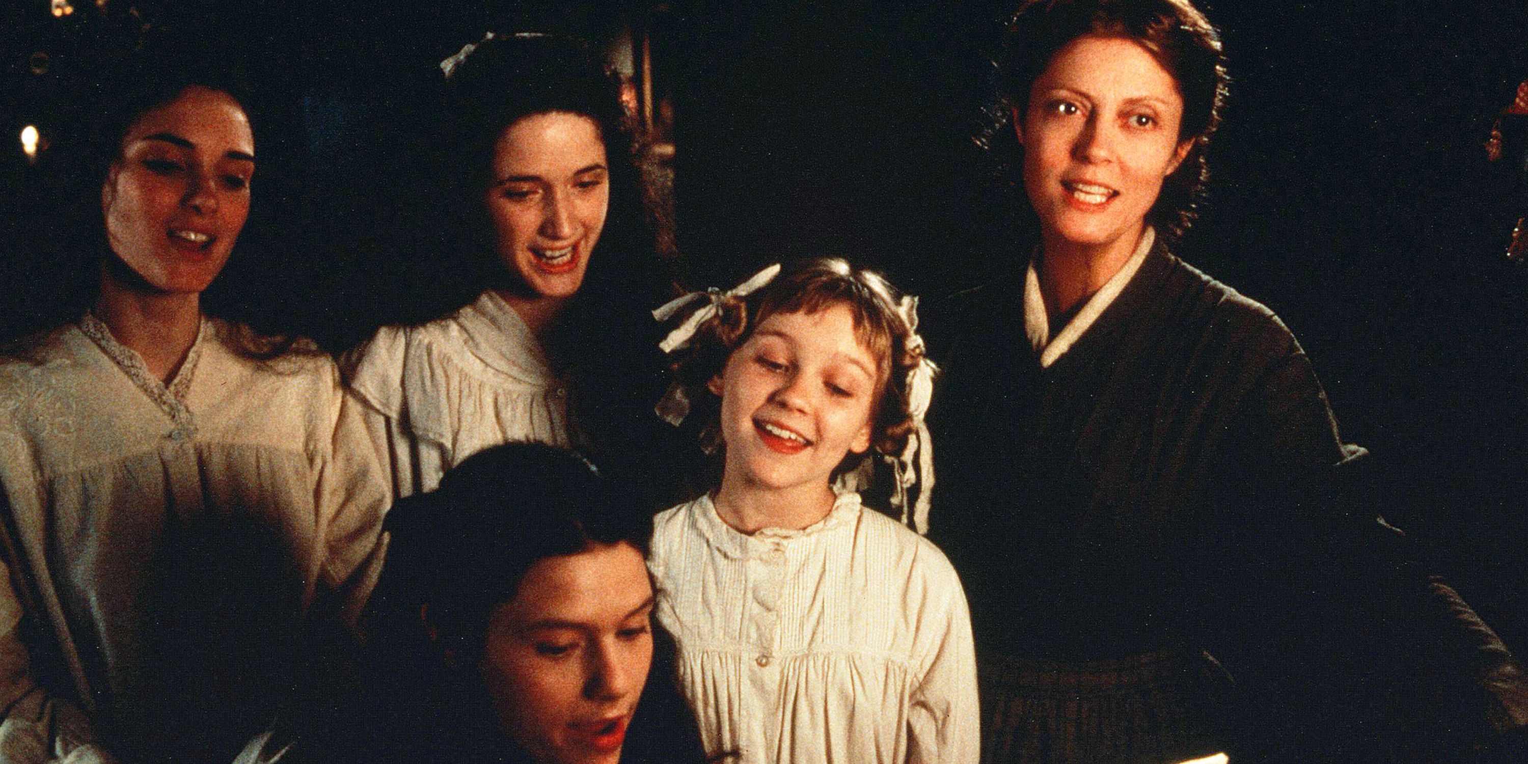 Susan Sarandon as Marmee March in 'Little Women', with Winona Ryder as Jo, Kirsten Dunst as Amy, Trini Alvarado as Meg, and Clare Danes as Beth, the March sisters. They are by a piano singing. 