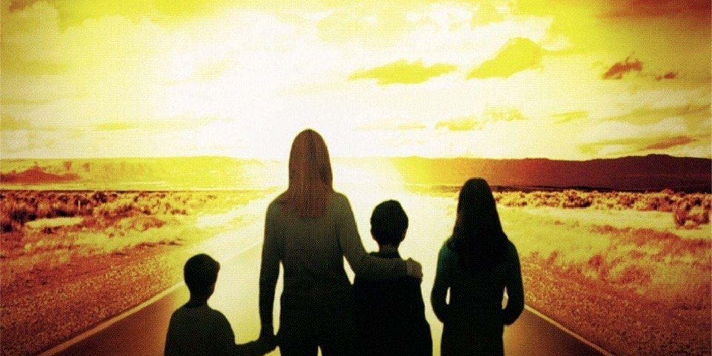 A woman and three children stand on a highway, looking at a nuclear blast on the 'Testament' movie poster. 