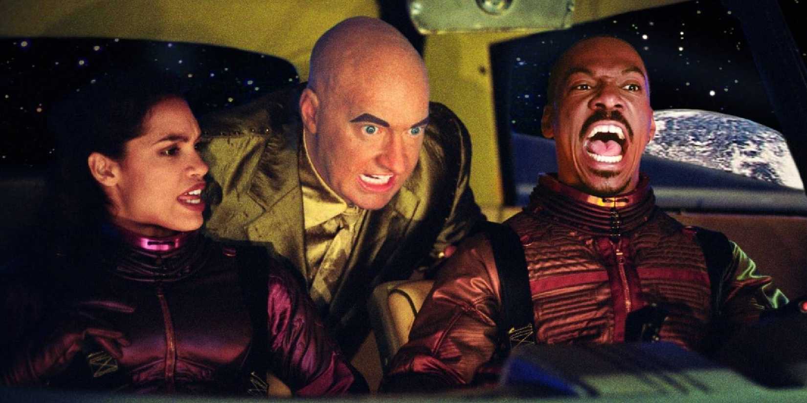 Three astronauts inside a vehicle in The Adventures of Pluto Nash