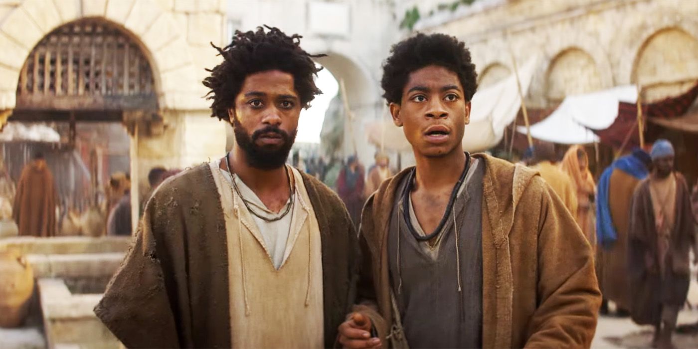 LaKeith Stanfield as Clarence and RJ Cyler standing side by side in an open space in ancient Jerusalem in The Book of Clarence