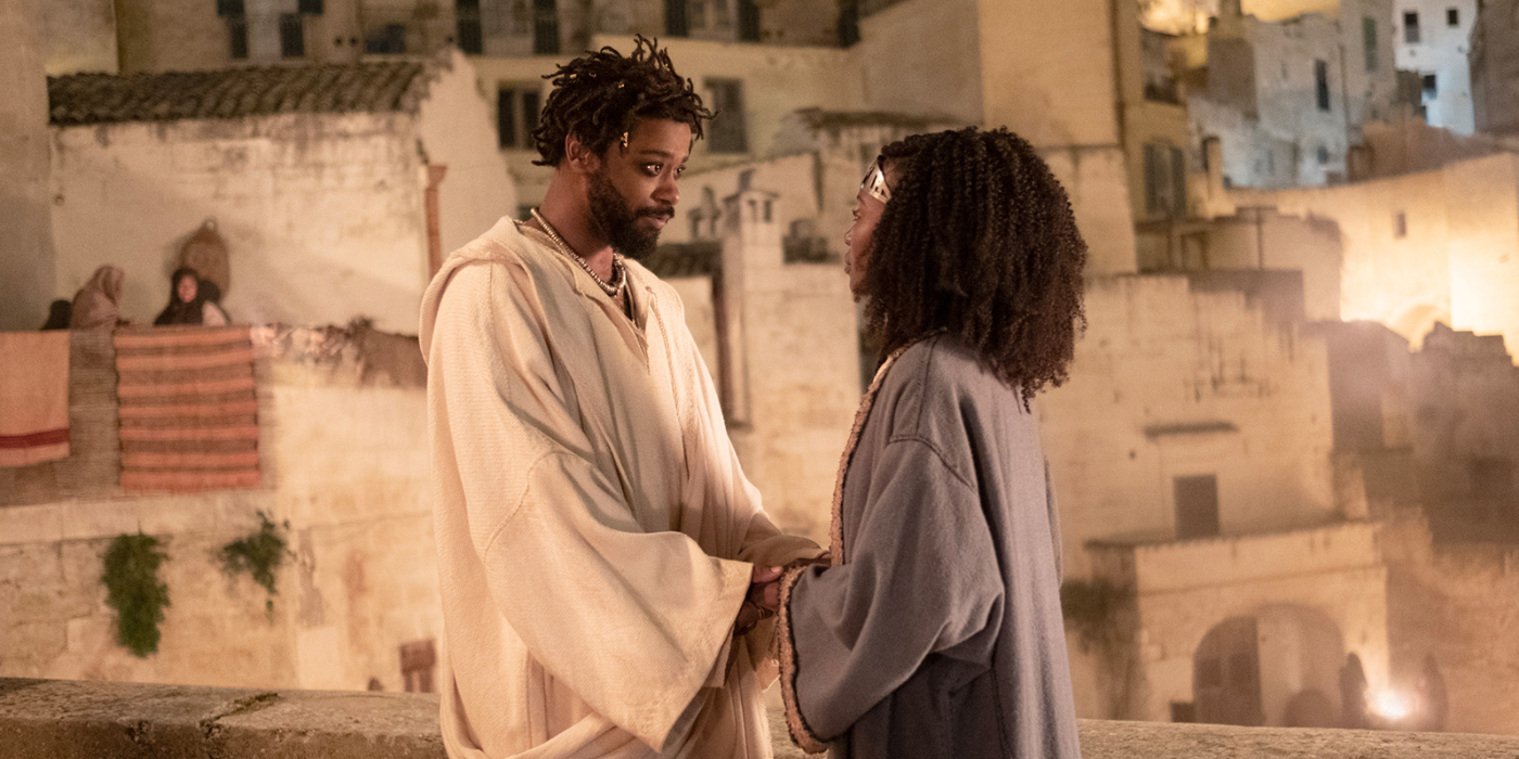 LaKeith Stanfield as Clarence and Anna Diop's character standing outside in ancient Jerusalem in The Book of Clarence