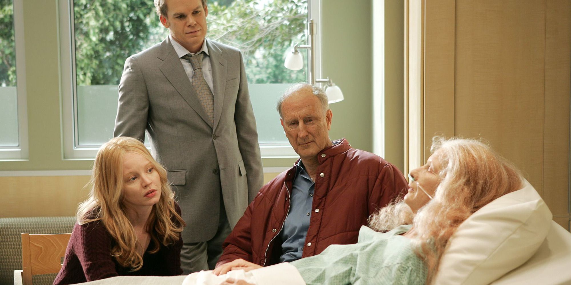 The cast of 'Six Feet Under' next to an old woman in a hospital bed