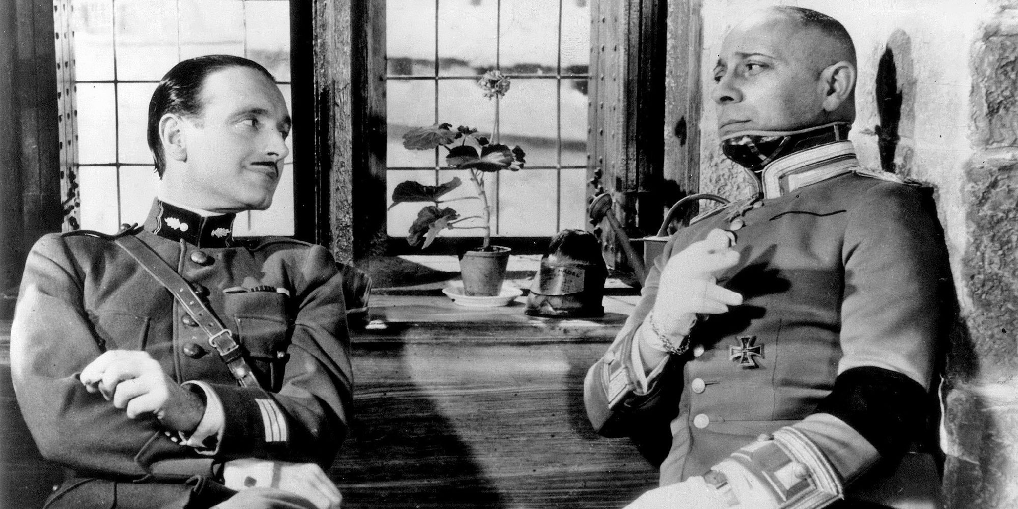 Erich von Stroheim and Pierre Fresnay sitting next to each other in The Grand Illusion.